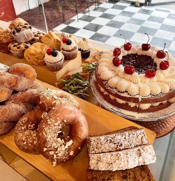 vegan bakery display with a variety of donuts and cake at just what i kneaded in LA