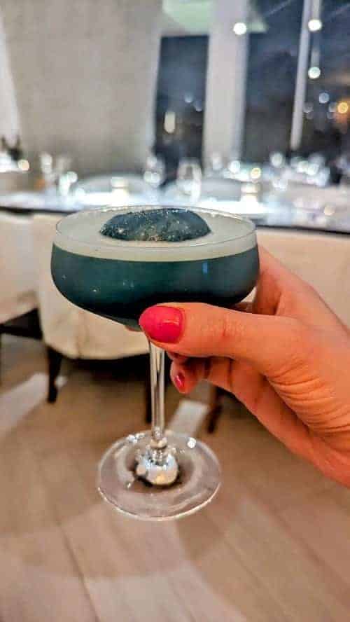 a turquoise blue cocktail at the palmaia resort in playa del carmen