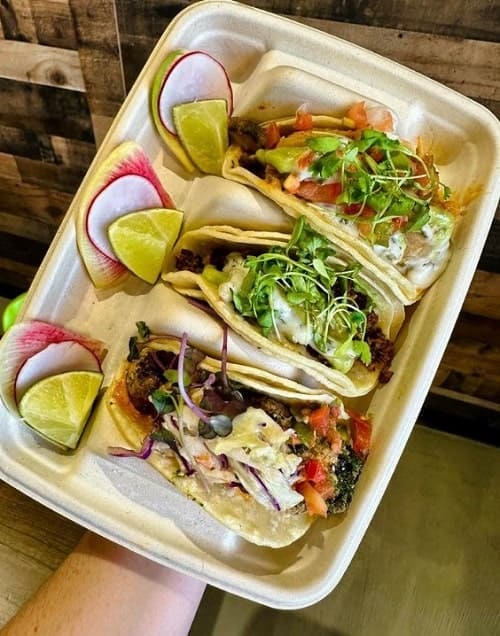 a trio of colorful vegan tacos in a beige tray from chagaroot in las vegas