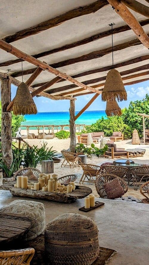 beachfront eolo bar with wicker seating on the sand at the palmaia resort in playa del carmen