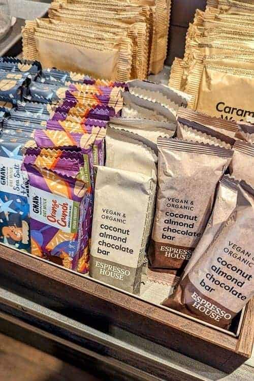 an display of vegan granola and snack bars at the checkout of espresso house in copenhagen