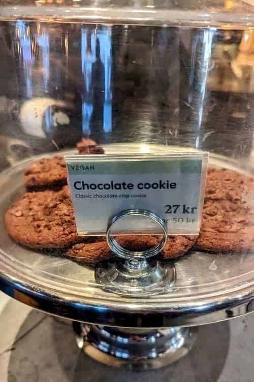 vegan chocolate cookies on a glass cake stand at the espresso house in copenhagen