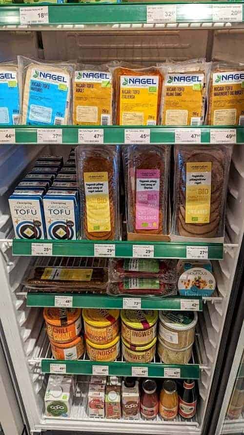 a display of perishable vegan foods like tofu and cheese at the health food store helsam in copenhagen 