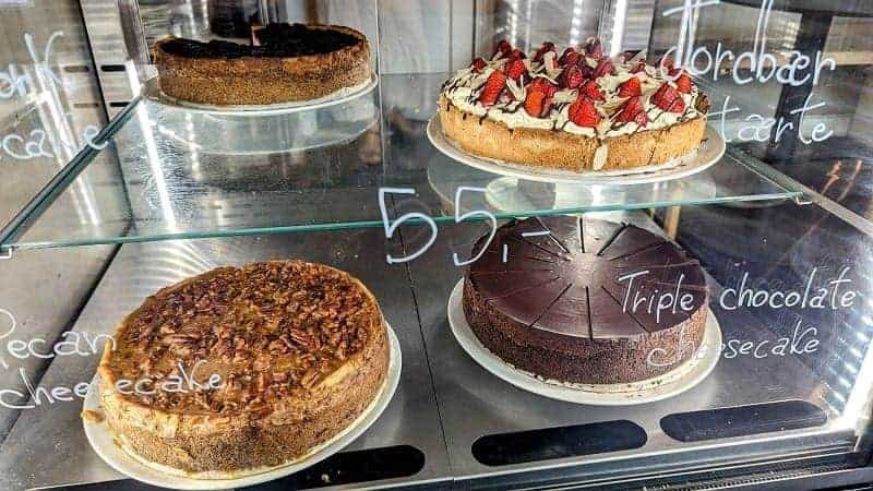 a display of four vegan cheesecakes at the vegan cafe and bakery kaf in copenhagen