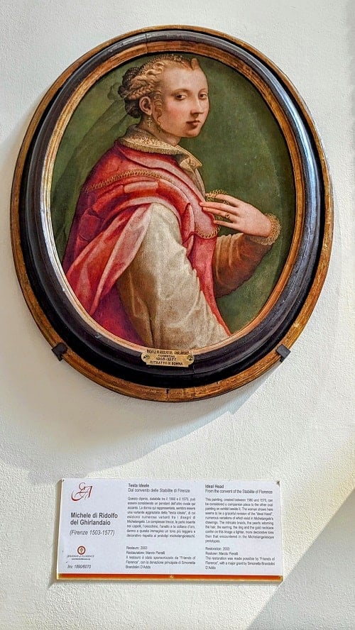 a round portrait of a man in a red cape at the Accademia Gallery