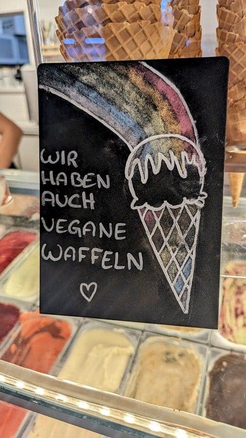 a black sign that says we have vegan waffle cones at Luicella's Ice Cream in hamburg