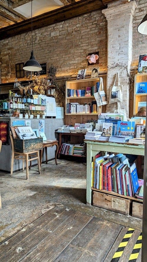 inside of the rustic bookstore Sullaluna Libreria & Bistrot