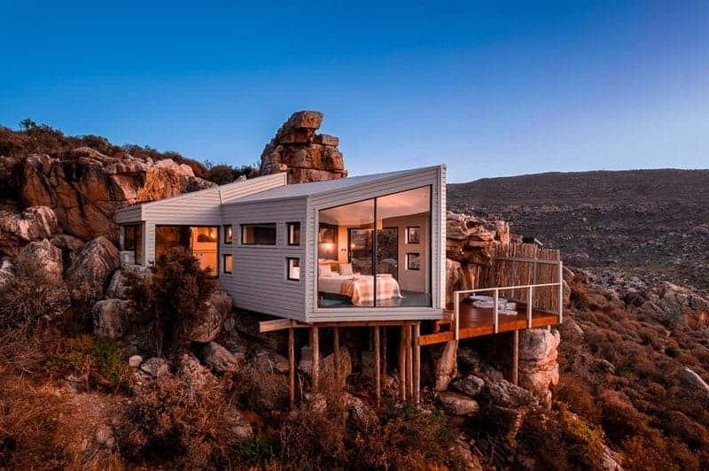 beautiful hidden wellness lodge hidden in the mountain at dusk in south africa