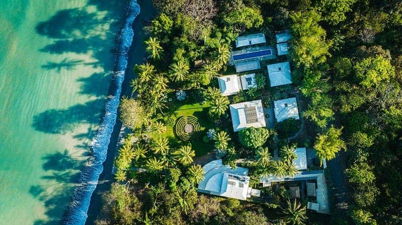 overhead view of the vegan-friendly yoga retreat blue oso tucked in the rainforest, near the beach in costa rica