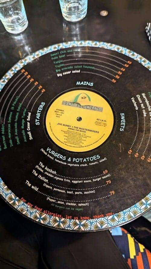 broc the kasbah's vegetarian menu on an old black vinyl record