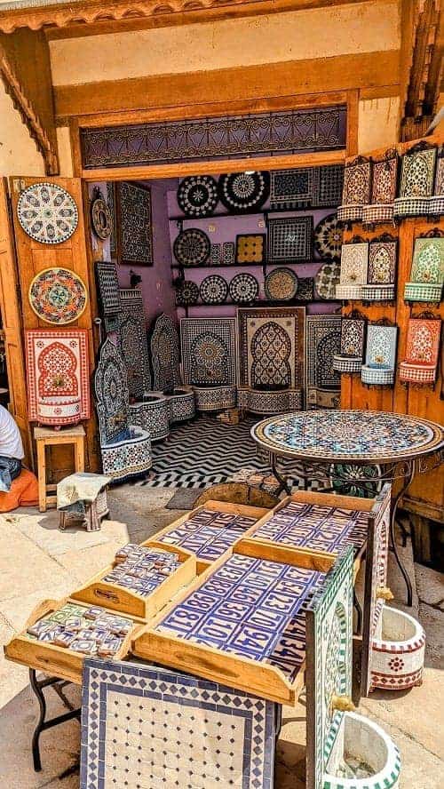 a store with colorful mosaic tiles and pottery in the fes medina