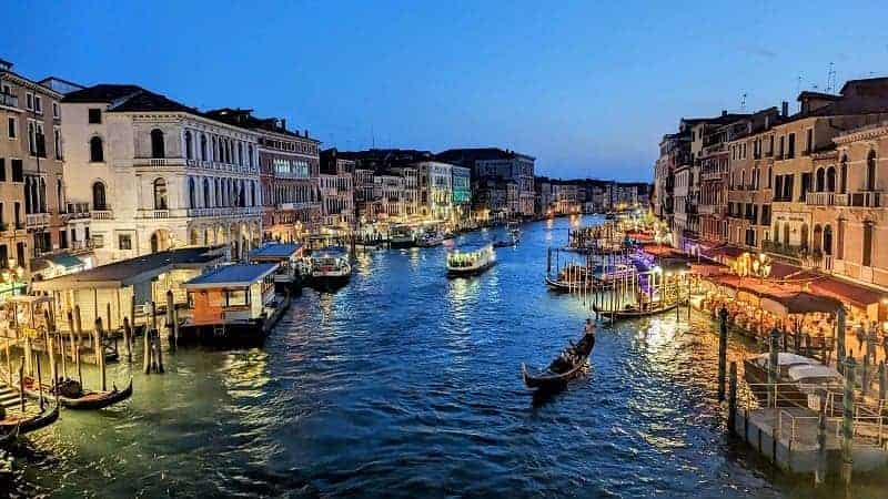 grand canal in venice italy at night lit but the cafes and bistros along the canal