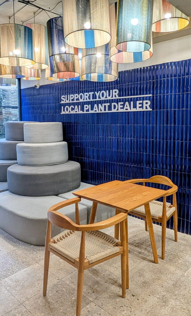 silver sign that says support your local plant dealer at mora mora