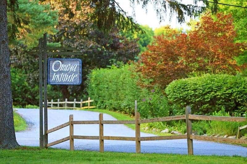 the wooded entrance to the omega institute in upstate new york during the summer