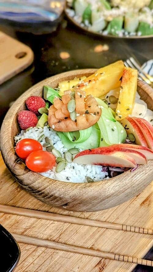 vegan poke bowl with white rice, veggies, and fruit at the vegetarian cafe broc the kasbah in morocco