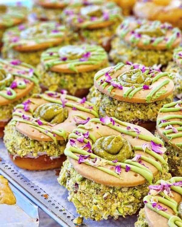 vegan pistachio covered donuts filled with cream from bake my day in copenhagen