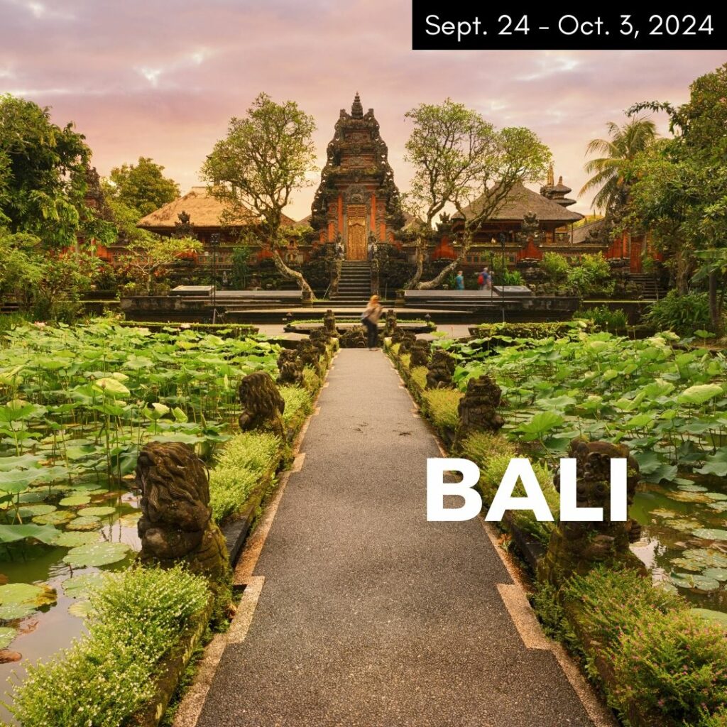 a stone path leading to a Balinese temple surrounded by a lush jungle in bali on a promotion for a vegan tour