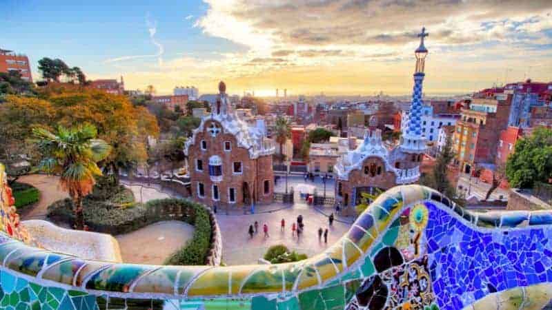 colored brightly tield park guells that over looks barcelona on a sunny day
