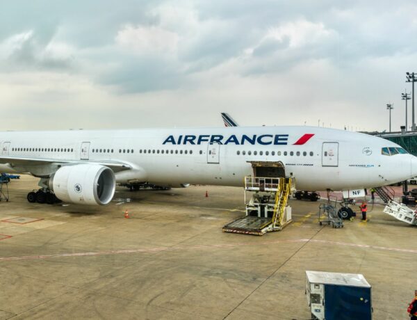air france plane parked at an airport waiting to load luggage