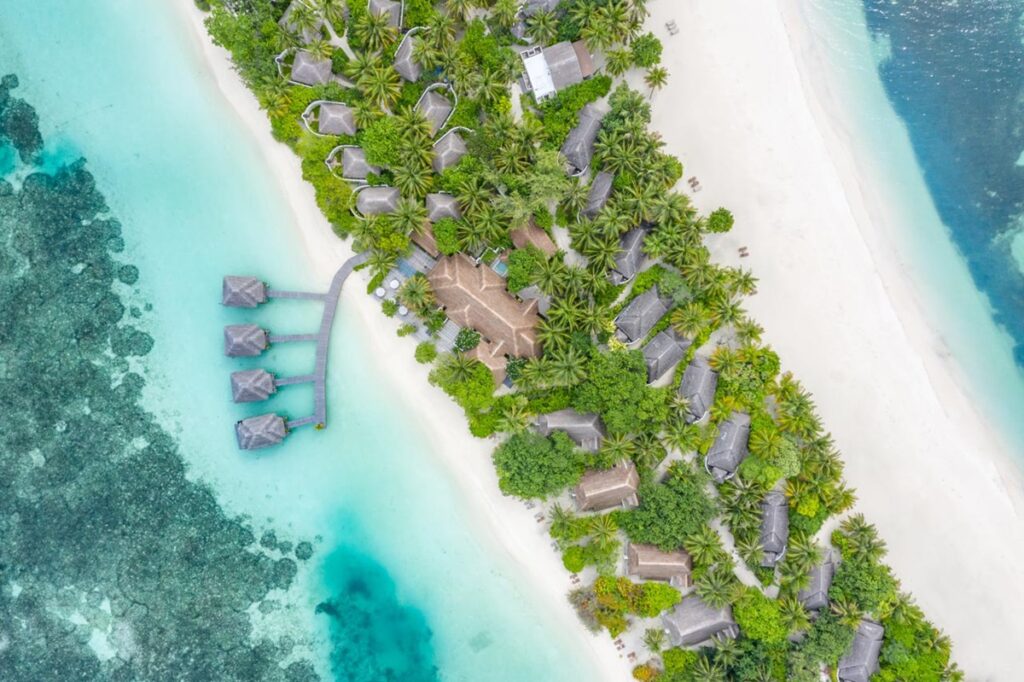 overhead view of the accommodations and island at the vegan-friendly Lux South Air resort in the maldives
