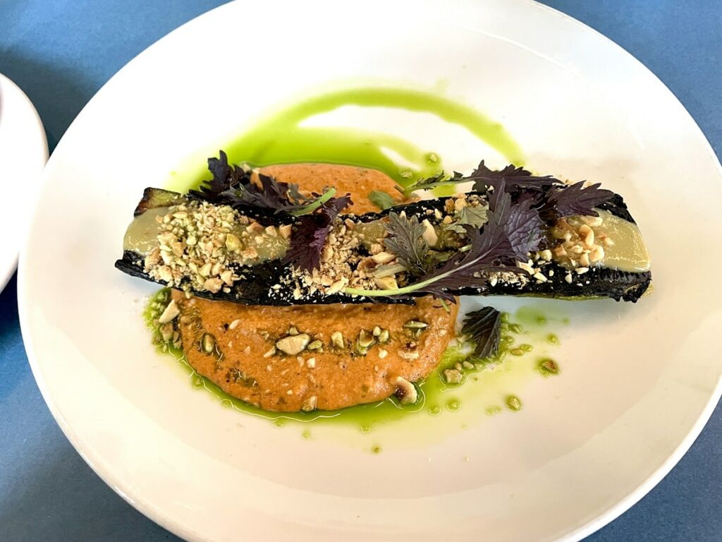 grilled eggplant over a bed of red pepper pesto at somebody people in denver