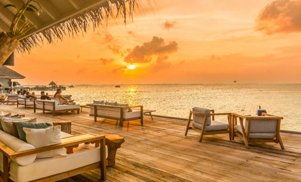 orange sunset over the water in the maldives at the vegan friendly resort JA Manafaru