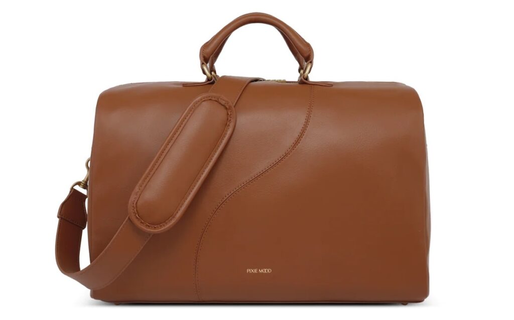 dark tan vegan leather weekender bag on a white background from pixie mood