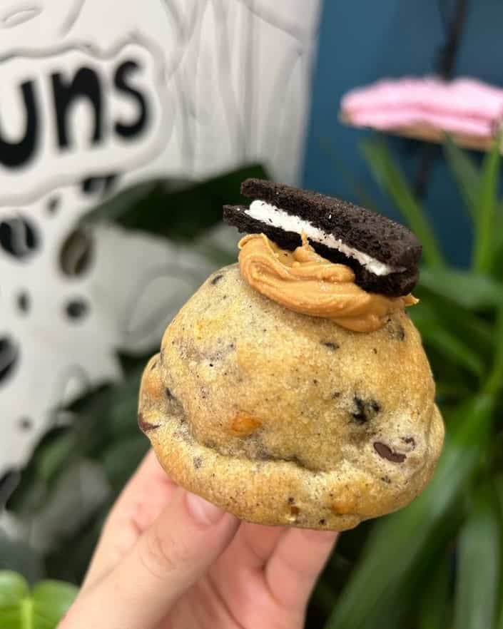 a single vegan cookie stuffed with peanut butter and topped with half of an oreo cookie in edinburgh