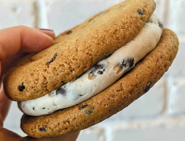 vegan chocolate chip cookie sandwich with cream in the middle at a bakery in madrid
