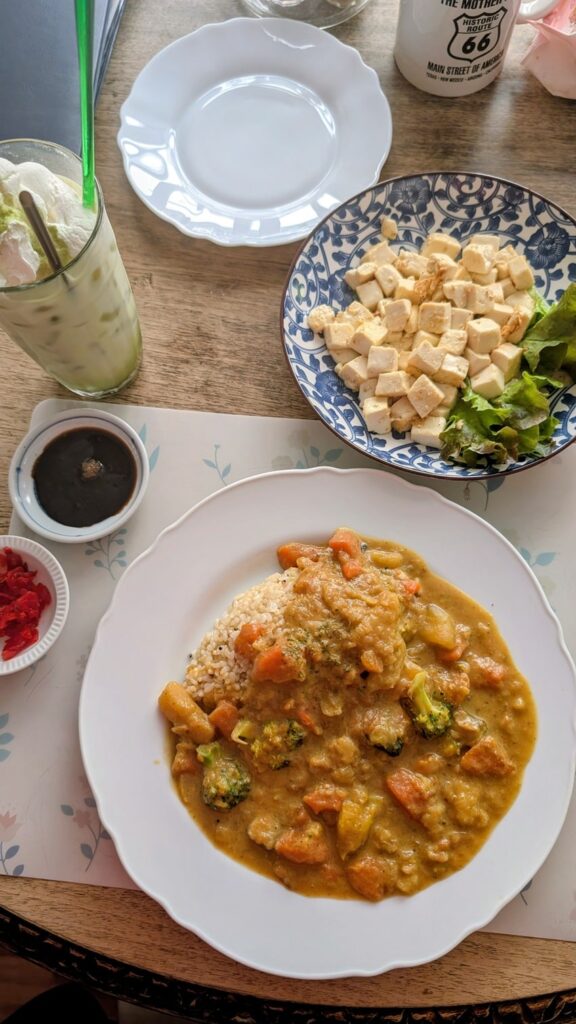 japanese curry with a large plate of fried tofu and a matcha at Bonita Cafe and Social Club in bangkok