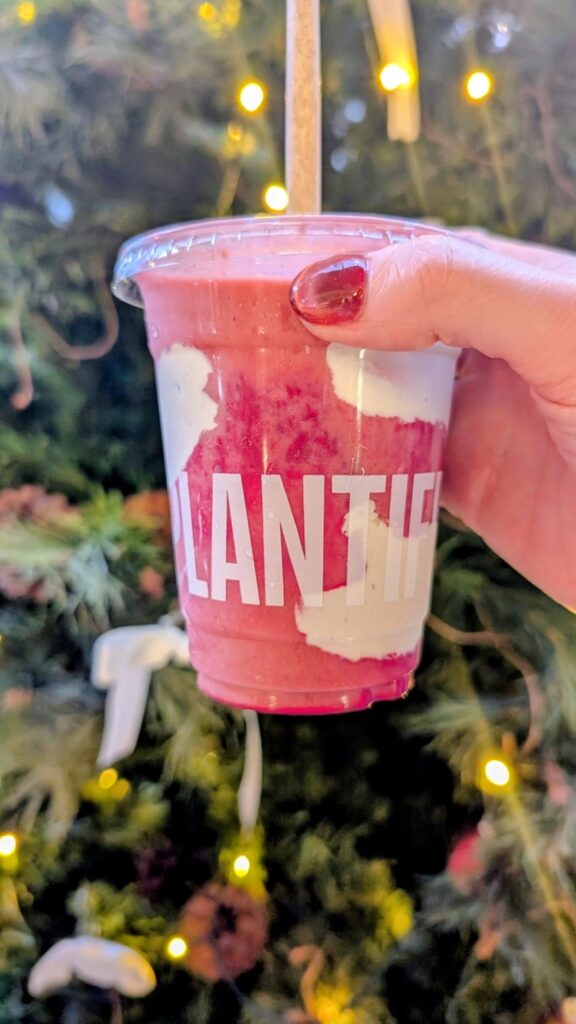 pink berry smoothie with a swirl of cashew cream at Plantiful