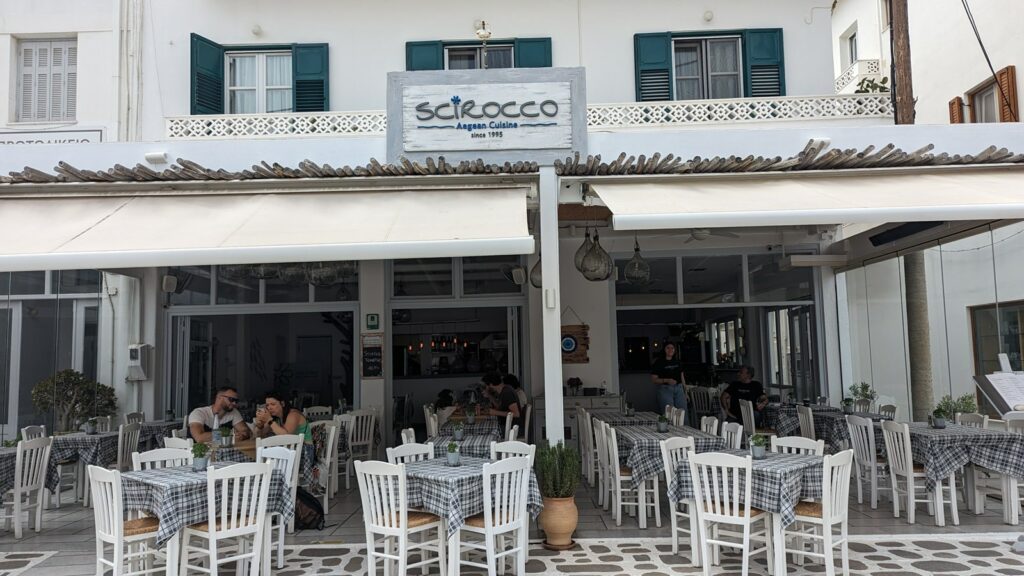 the white washed front of the vegan friendly Scirocco Restaurant in naxos