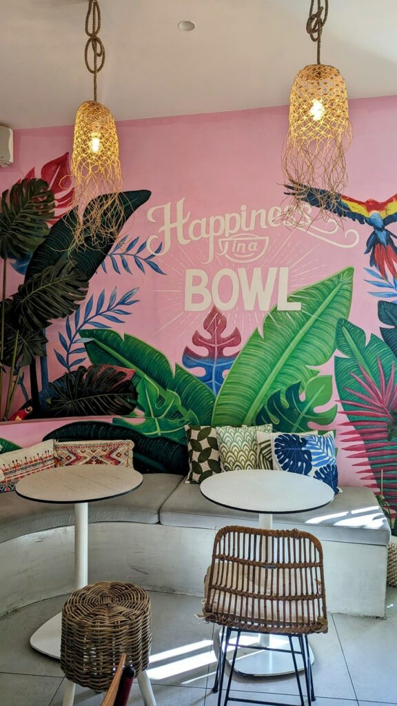 inside of the pink and floral dining area at happy blender in athens greece