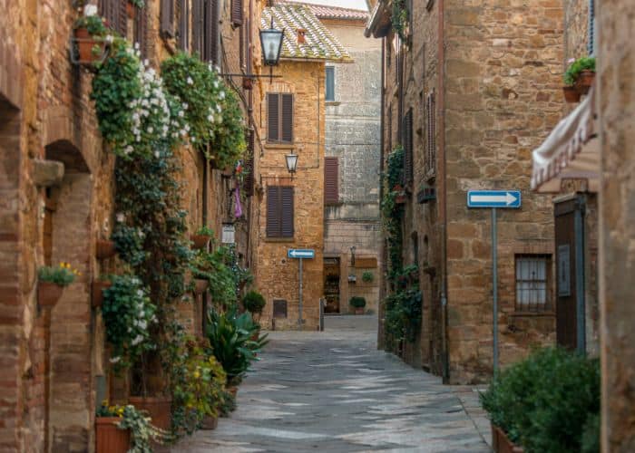 a quiet stone village with fresh flowers in tuscany