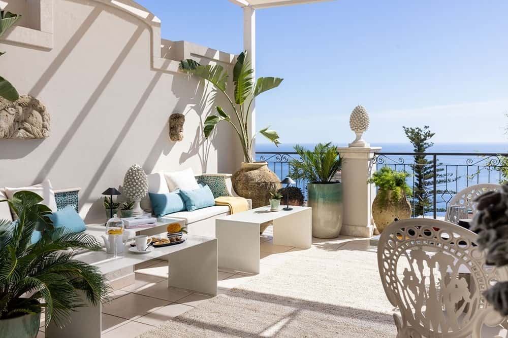 the bright and modern rooftop lounge at Hotel Taodomus on a clear, sunny day