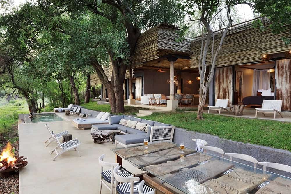 the outside seating area made of natural fabrics, wood and wicker at the matesi rover house in africa