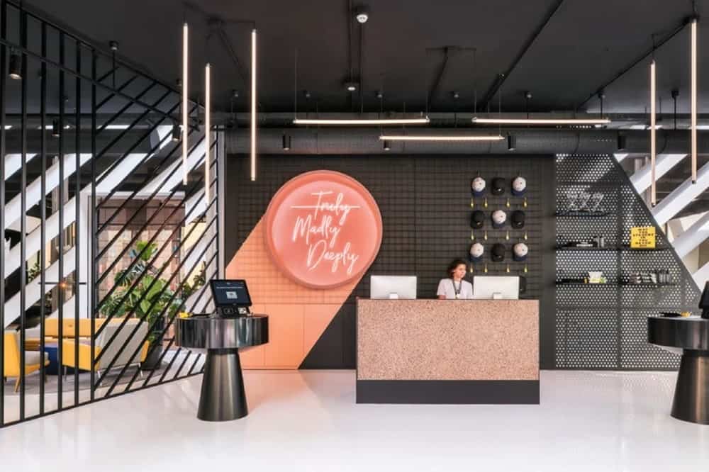 the brightly colored and modern lobby of the social hub in florence