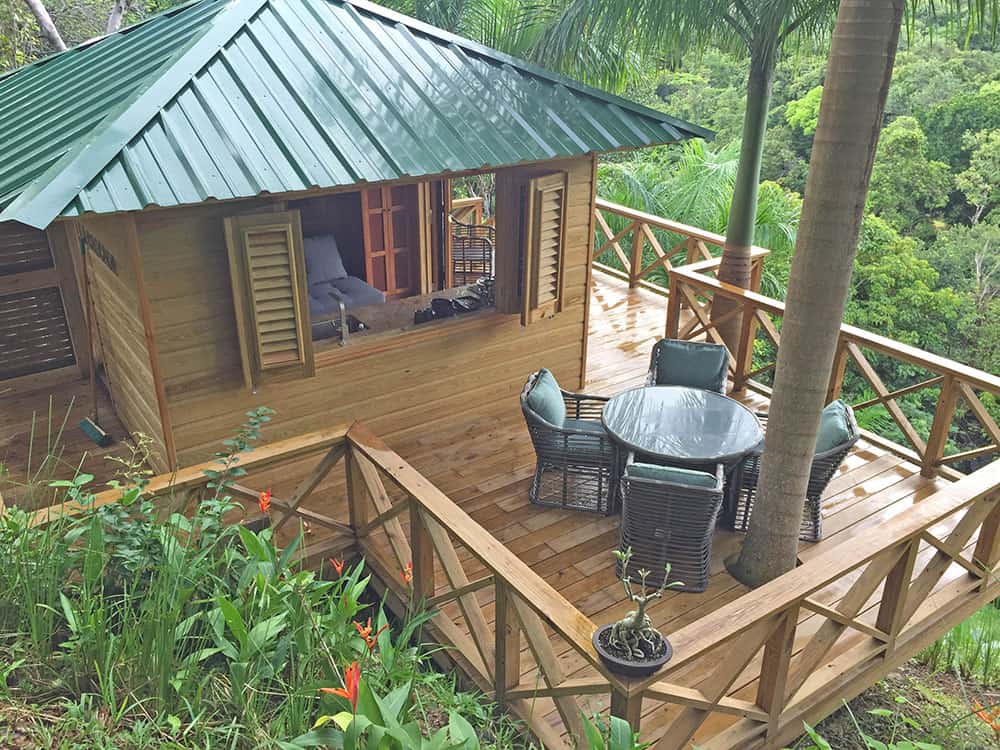 overhead shot of the outdoor desk attached to a wooden treehouse in the middle of the jungle at Yuquiyú Treehouses in puerto rico