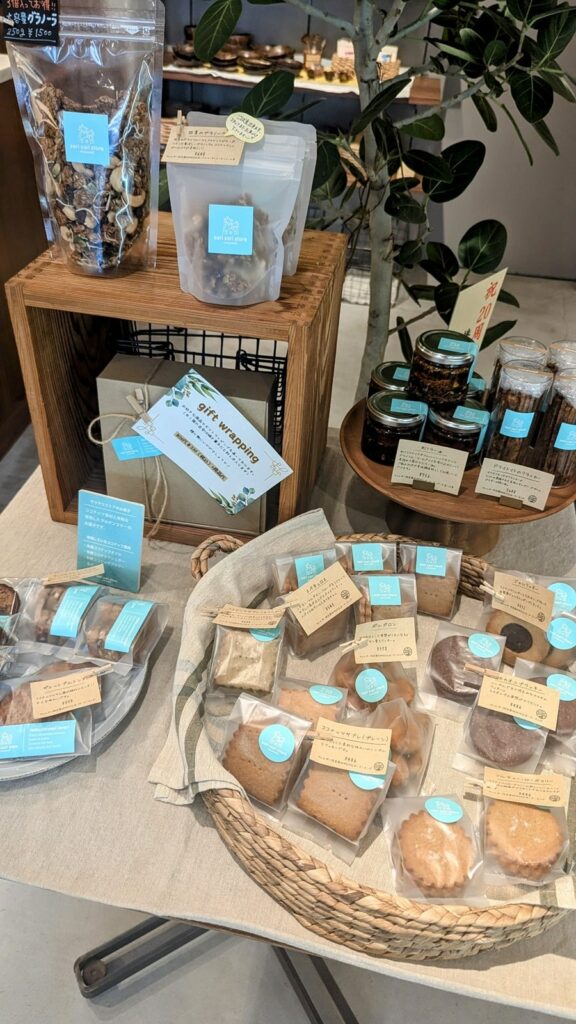 a display of individually wrapped vegan coconut baked treats at the sari sari cocowell shop in osaka