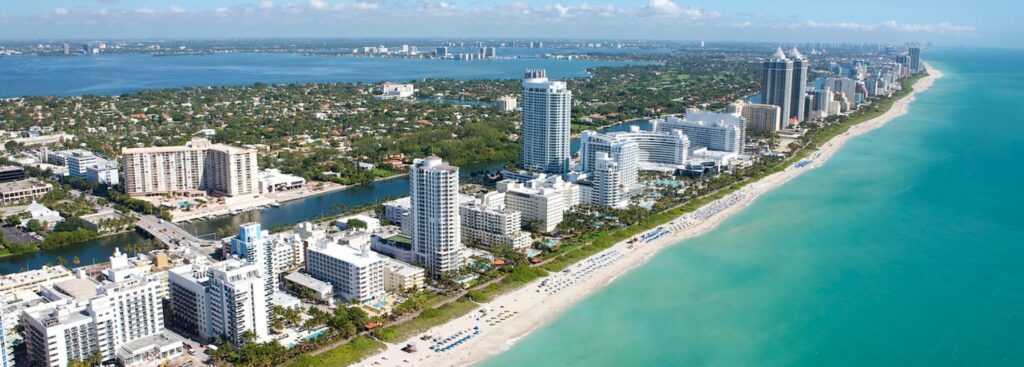 overhead shot of the miami beach area surrounded by turquoise waters