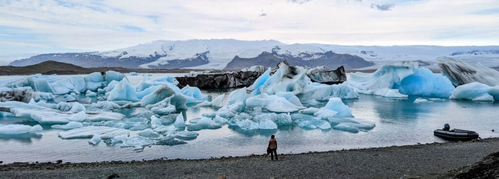 iceland glacier lagoon with large icebergs floating in the water on a bright day