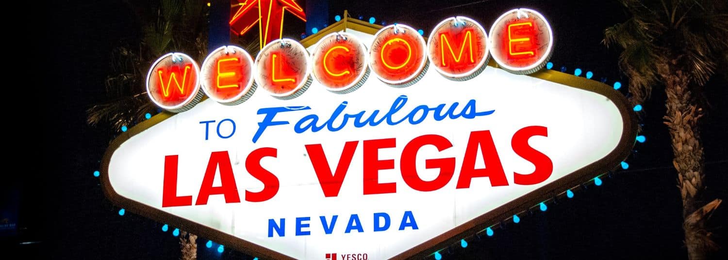 the welcome to las vegas sign lit up at nighttime