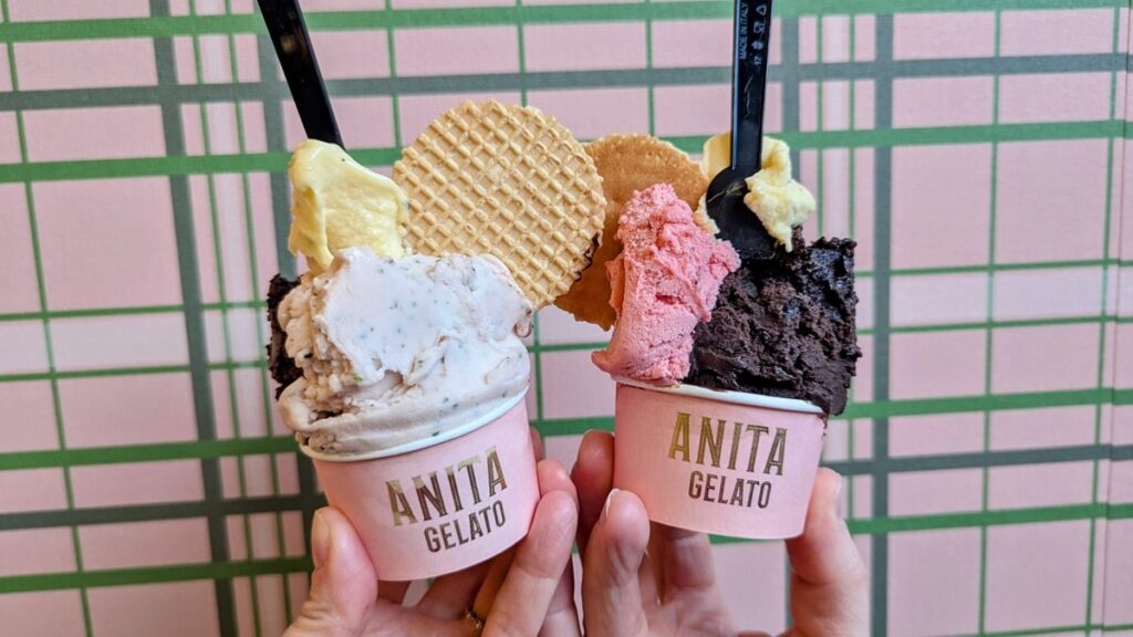 two pink cups filled with multiple scoops of vegan chocolate, watermelon, and cookie ice cream from anita gelato in san juan