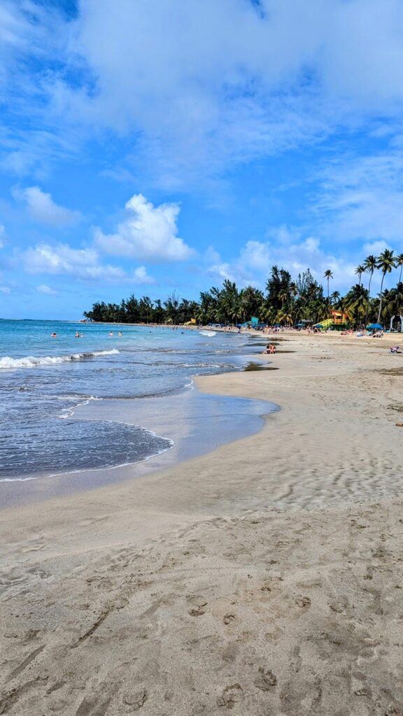 luquillo beach on a bright and partly cloudy day in puerto rico