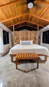 queen bed against a bamboo backboard at la finca nueva retreat in costa rica 