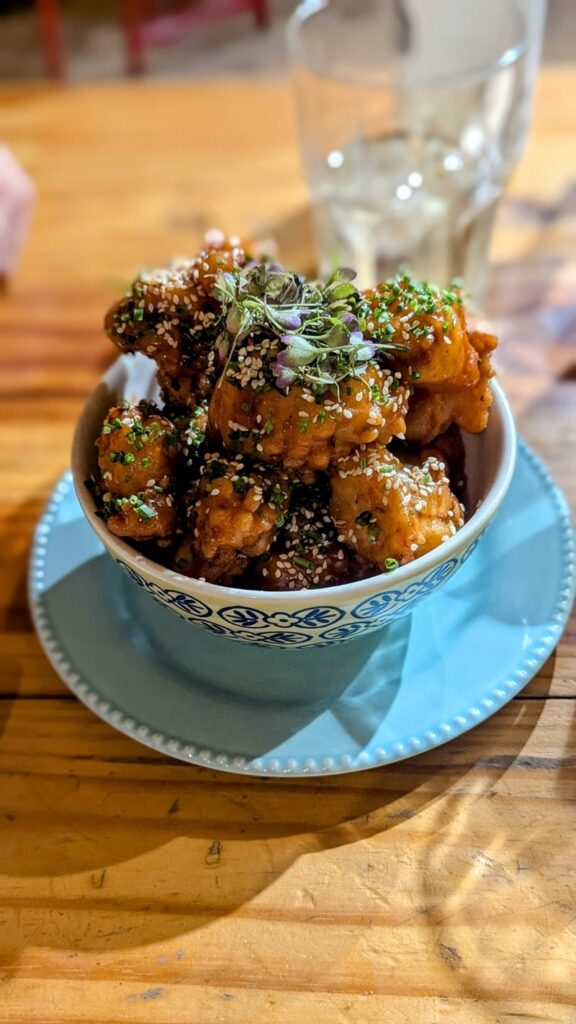a large round bowl filled with fried cauliflower at helecho sushi in medellin