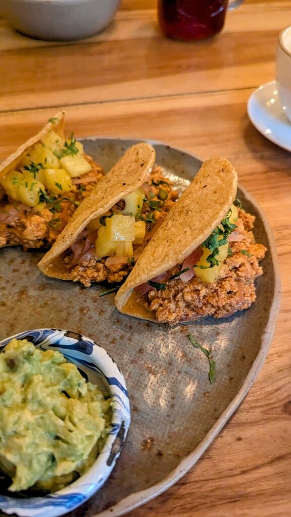 vegan tacos pastor with a side of guac at kaime restaurant in medellin