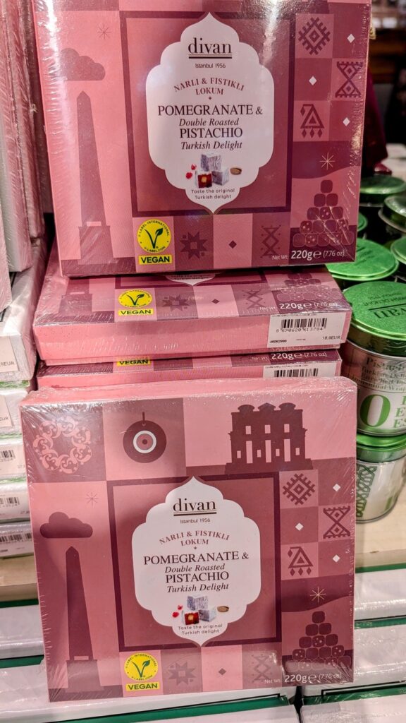 a stack of pink boxes with vegan turkish delights 