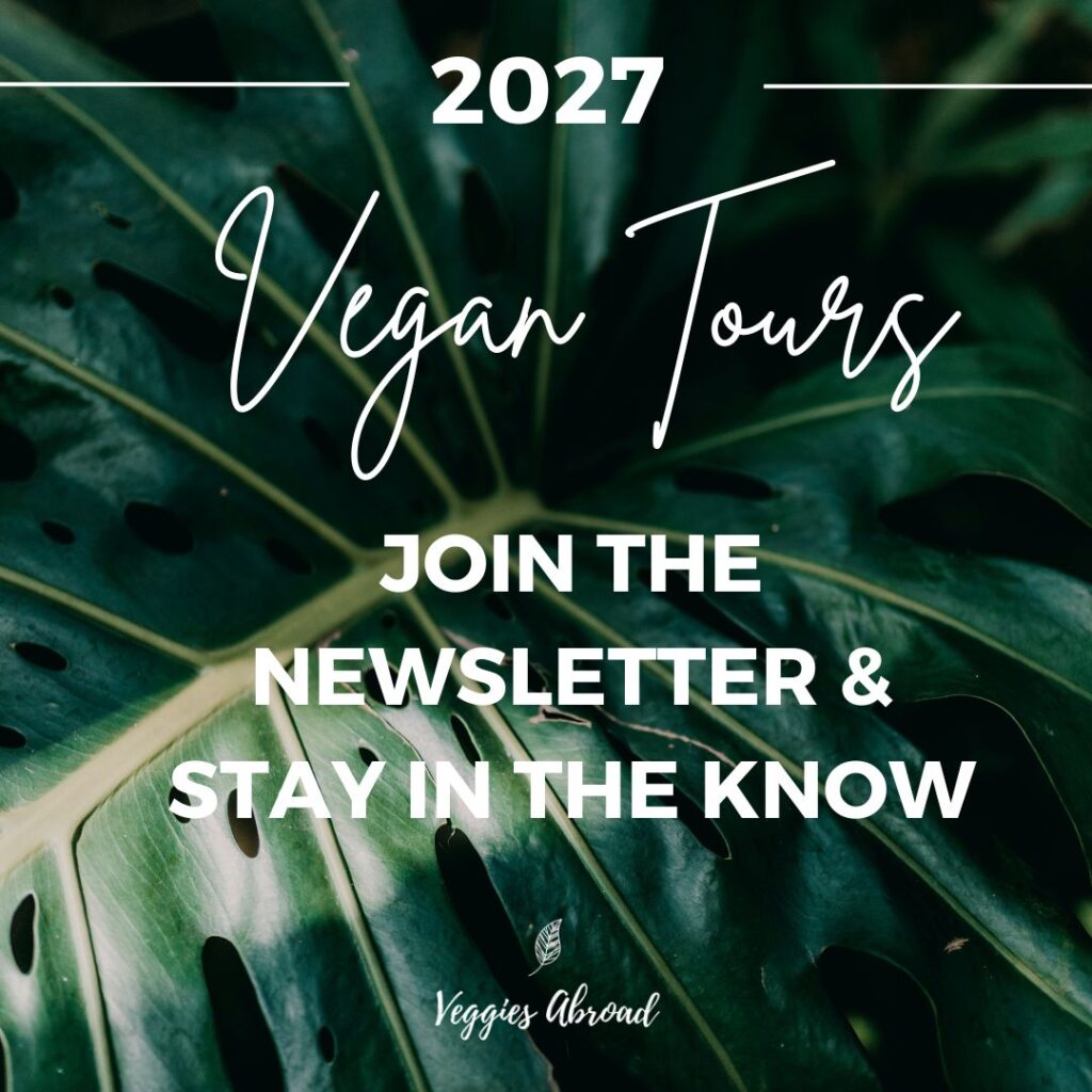 2027 vegan tour promo on a dark leafy background