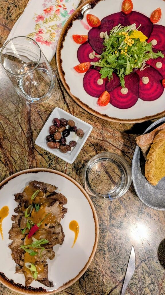 overhead view of a vegan beet carpaccio and a fried mushroom dish from Jardineiro in porto